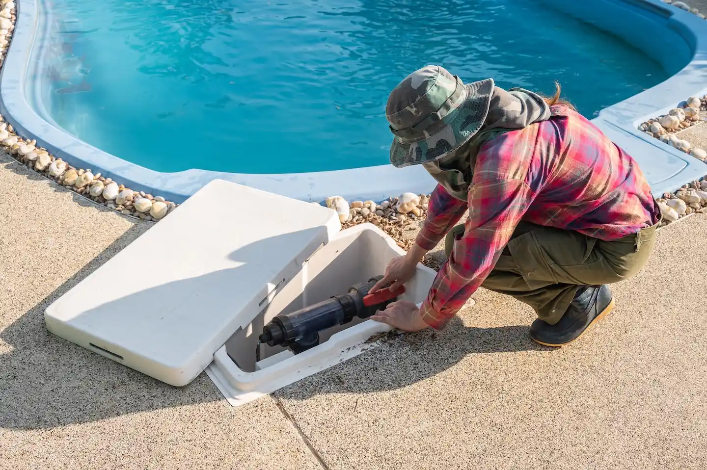 How To Find A Leak In Your Pool 2 Pool repair technician testing and repairing a pool pump.