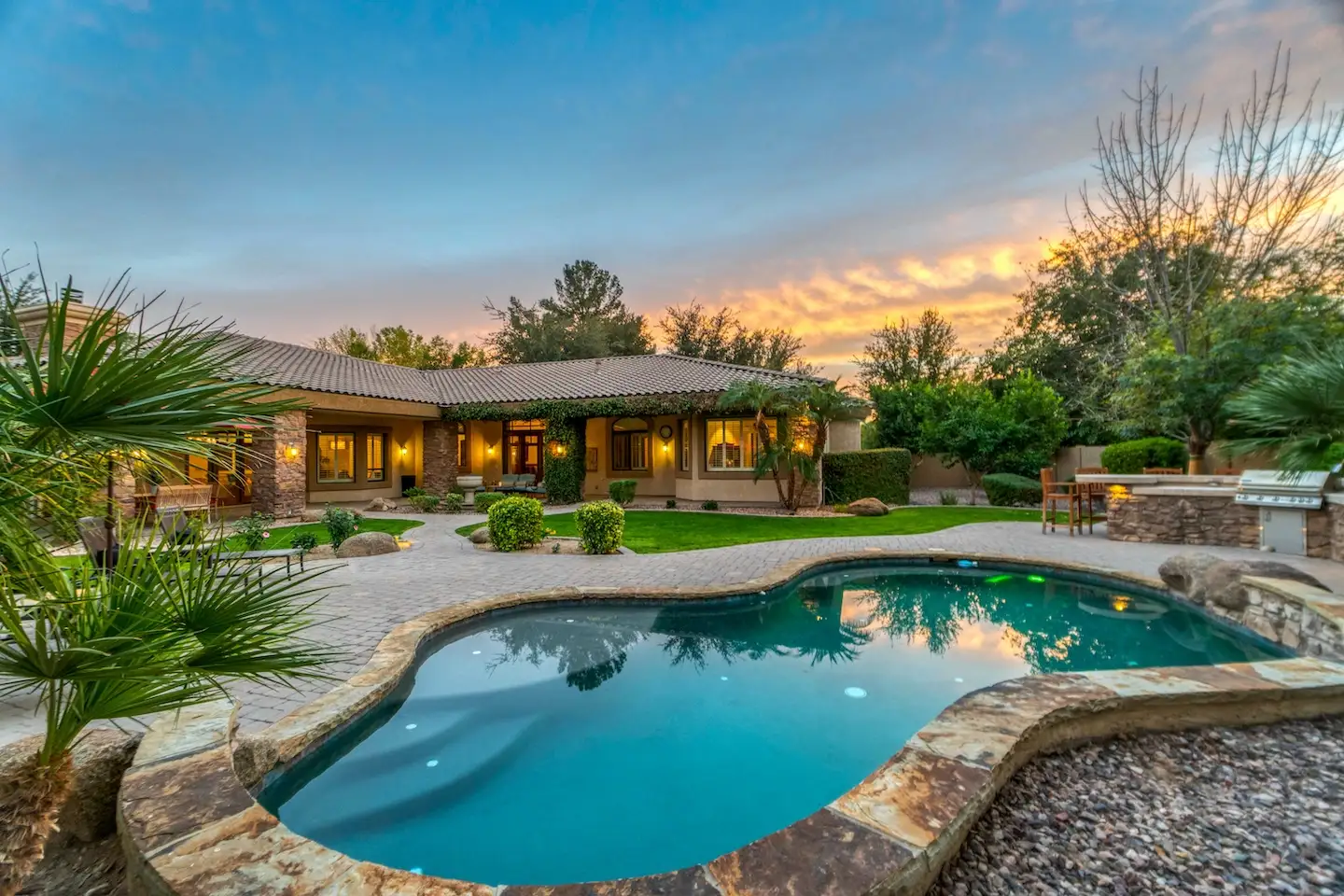 How to Get a Custom Pool Quote in Texas: What to Expect 2 Freeform pool in a vibrant backyard in the Texas hill country.